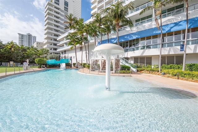 view of swimming pool featuring pool water feature