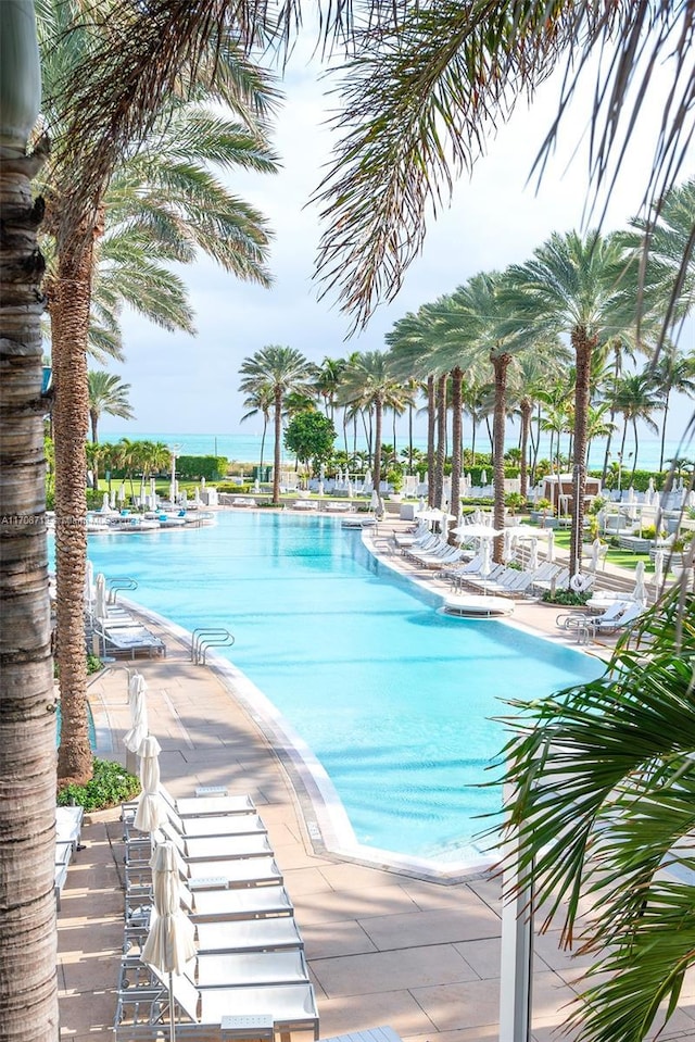 view of pool with a water view