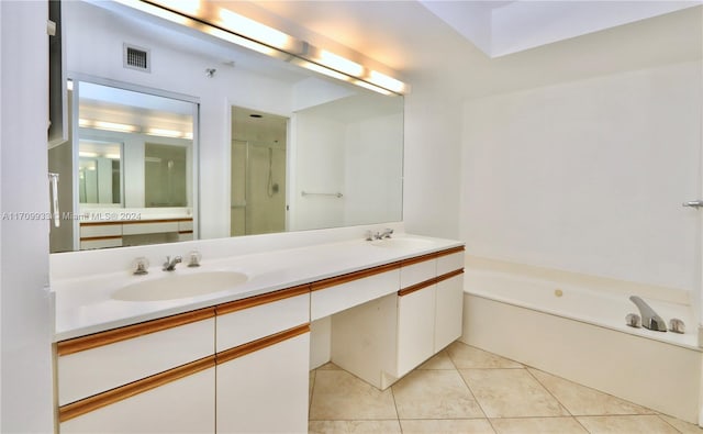 bathroom with tile patterned flooring, vanity, and independent shower and bath