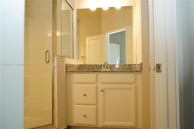 bathroom featuring vanity and walk in shower