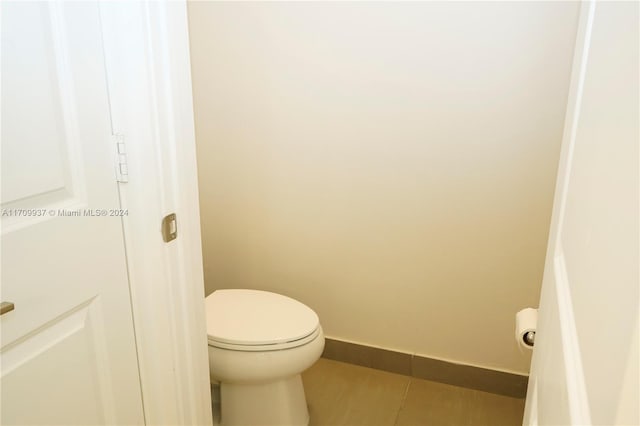 bathroom featuring tile patterned floors and toilet