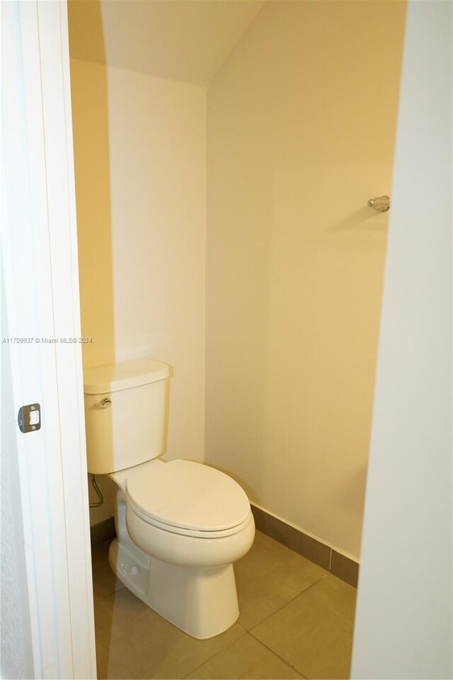 bathroom featuring tile patterned floors and toilet