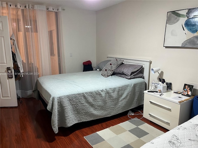 bedroom featuring dark hardwood / wood-style floors