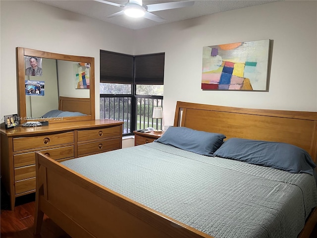 bedroom featuring ceiling fan and dark hardwood / wood-style flooring