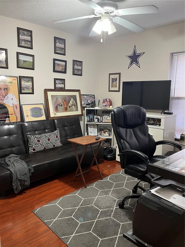 office featuring ceiling fan, hardwood / wood-style floors, and a textured ceiling