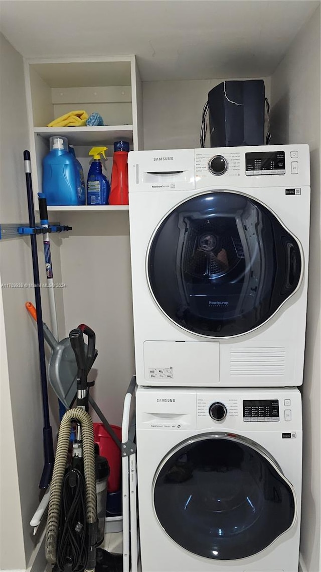 washroom featuring stacked washer / dryer