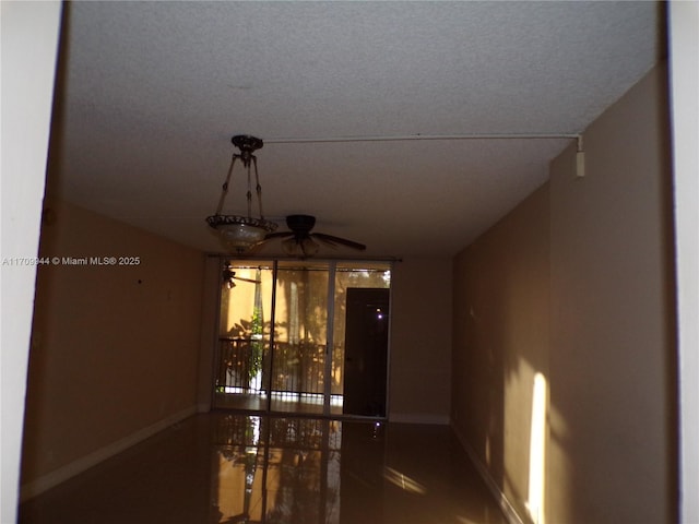 interior space featuring ceiling fan