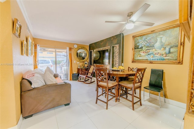 dining room with ceiling fan and crown molding