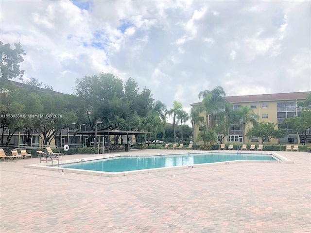 view of swimming pool with a patio