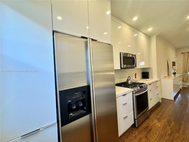 kitchen featuring white cabinets, dark hardwood / wood-style flooring, and stainless steel appliances