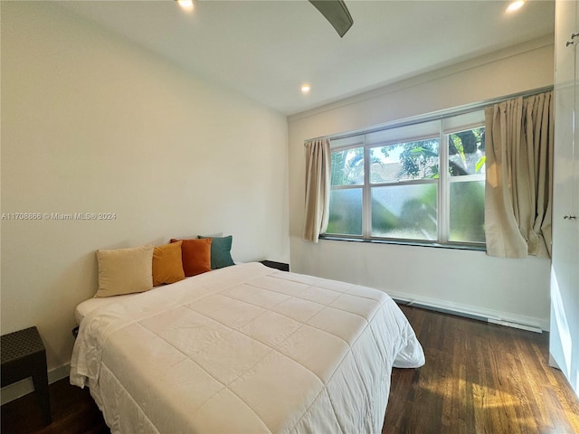 bedroom featuring ceiling fan and dark wood-type flooring