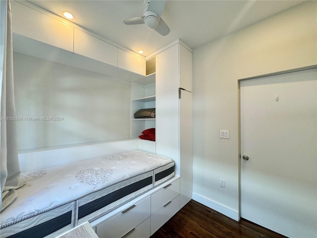 bedroom with ceiling fan and dark wood-type flooring