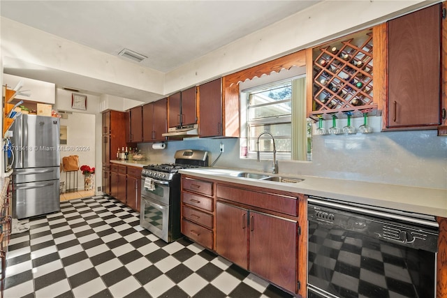 kitchen featuring sink, stainless steel appliances, and beverage cooler