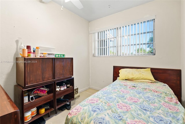 bedroom featuring light tile patterned floors and ceiling fan