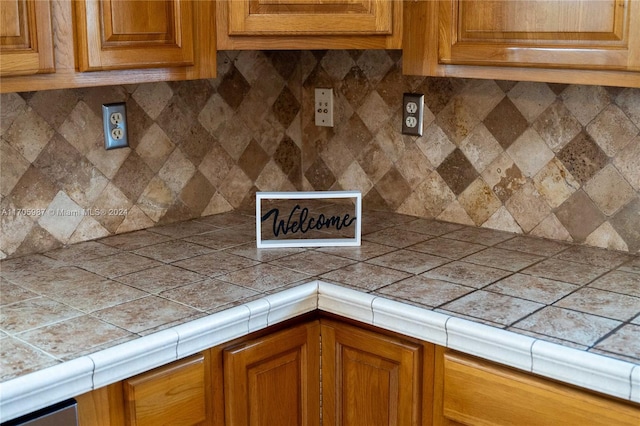 kitchen with backsplash and tile countertops