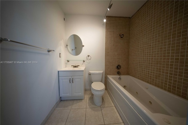 full bathroom with tile patterned floors, vanity, toilet, and tiled shower / bath