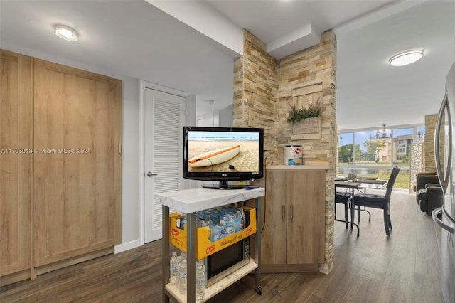 interior space with dark hardwood / wood-style flooring and a wall of windows