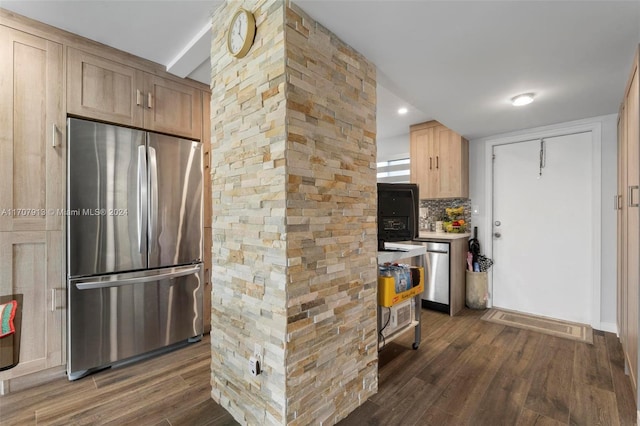 kitchen featuring tasteful backsplash, dark wood-type flooring, stainless steel appliances, and light brown cabinets