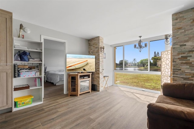 interior space featuring hardwood / wood-style flooring and an inviting chandelier