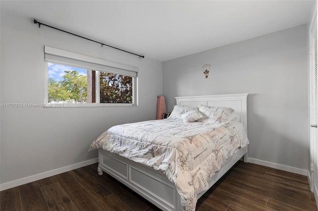 bedroom featuring dark wood-type flooring