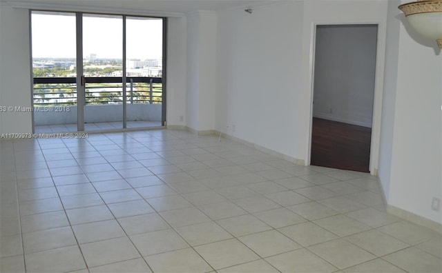 spare room featuring light tile patterned flooring