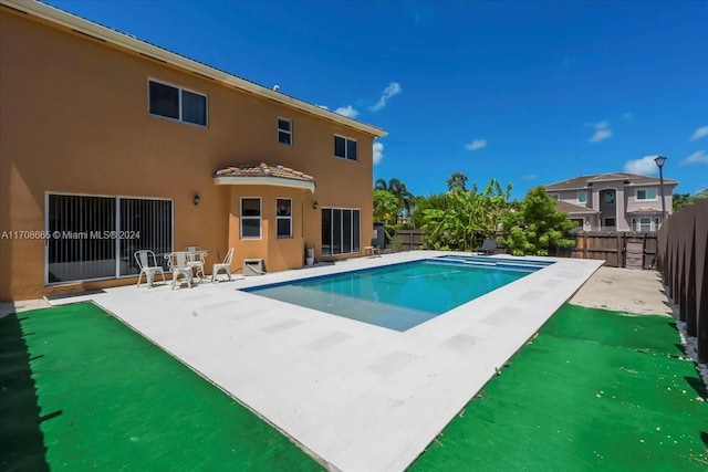 view of swimming pool with a patio area