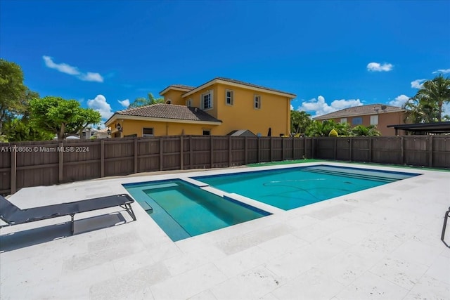 view of pool featuring a patio