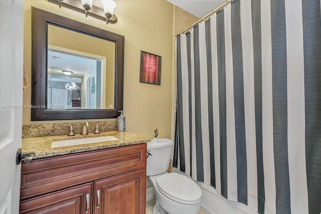 bathroom with vanity, curtained shower, and toilet