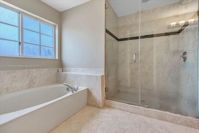 bathroom with tile patterned floors and plus walk in shower