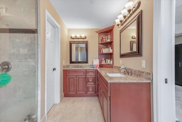 bathroom featuring vanity and walk in shower