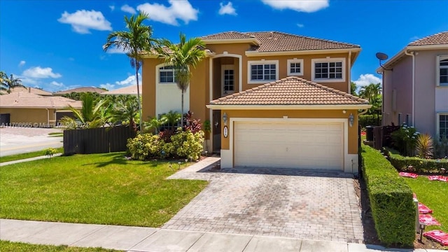 mediterranean / spanish-style house featuring a front yard