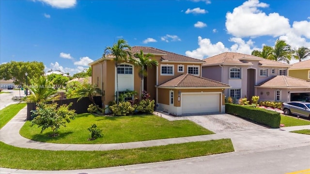 mediterranean / spanish-style home with a garage and a front lawn