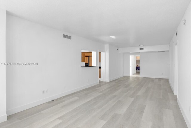 335 S Biscayne Blvd Unit 4109, Miami, FL 33131 - empty room with baseboards, visible vents, and light wood-style floors