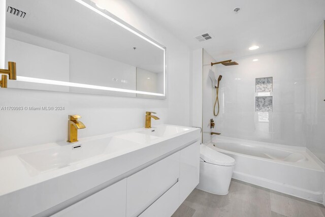 335 S Biscayne Blvd Unit 4109, Miami, FL 33131 - bathroom featuring a sink, visible vents, toilet, and shower / bathing tub combination
