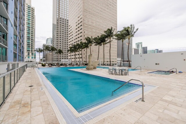 335 S Biscayne Blvd Unit 4109, Miami, FL 33131 - pool featuring a view of city and a patio