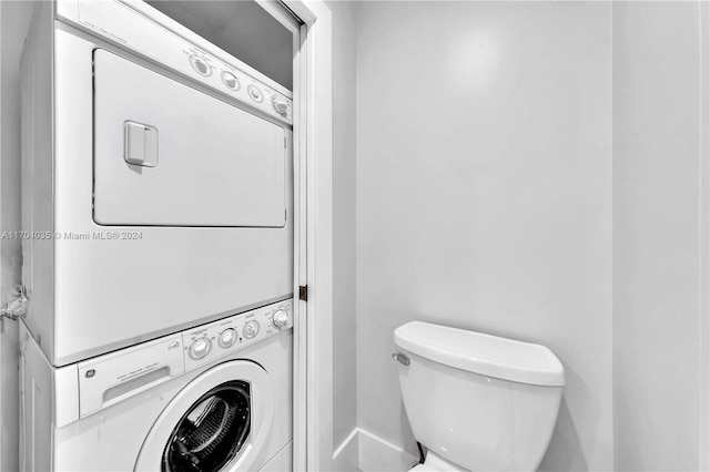 clothes washing area with stacked washer / drying machine