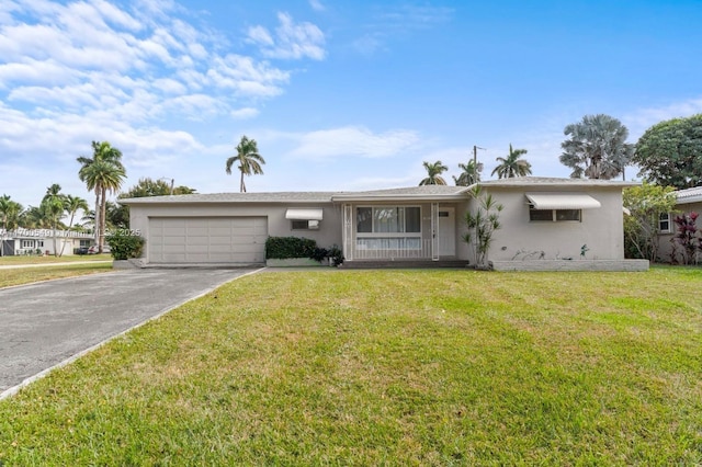201 Entrada Dr, Hollywood, FL 33021 - single story home featuring a garage, stucco siding, a front yard, and concrete driveway
