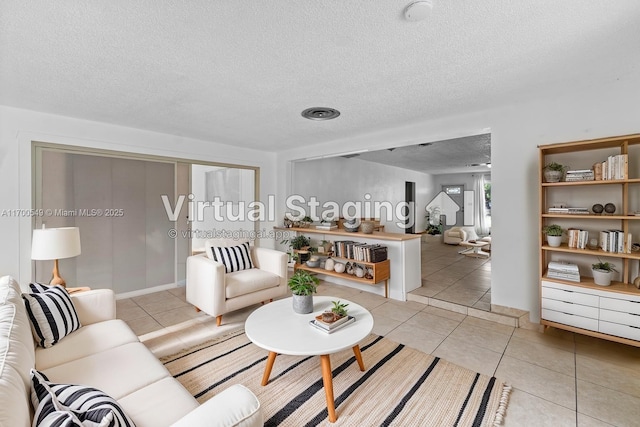 201 Entrada Dr, Hollywood, FL 33021 - living area featuring light tile patterned floors and a textured ceiling