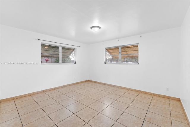 201 Entrada Dr, Hollywood, FL 33021 - unfurnished room with baseboards and light tile patterned floors