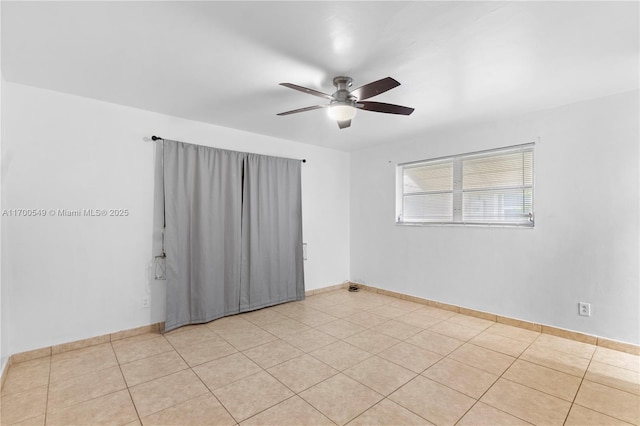 201 Entrada Dr, Hollywood, FL 33021 - empty room featuring light tile patterned floors, baseboards, and ceiling fan