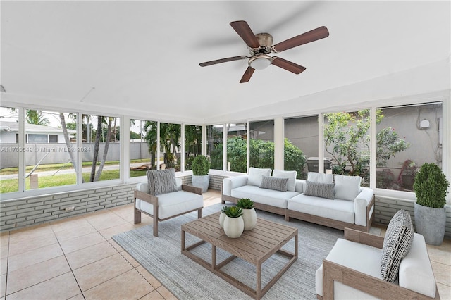 sunroom / solarium featuring ceiling fan and lofted ceiling