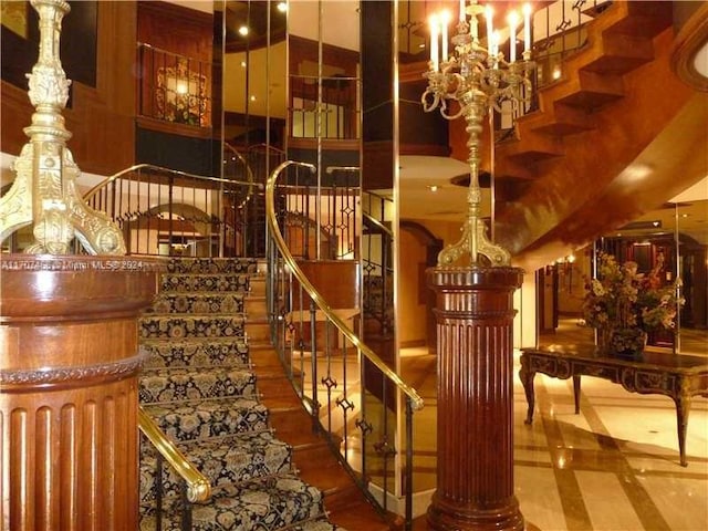 wine area with a chandelier and a high ceiling