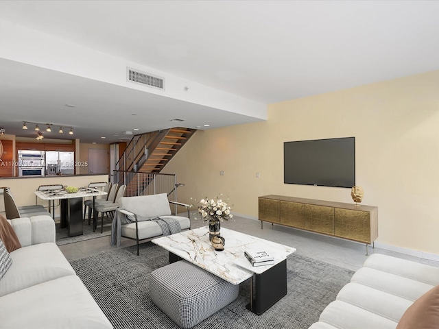 living room with tile patterned flooring