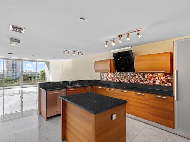 kitchen featuring expansive windows, sink, a center island, and dishwasher