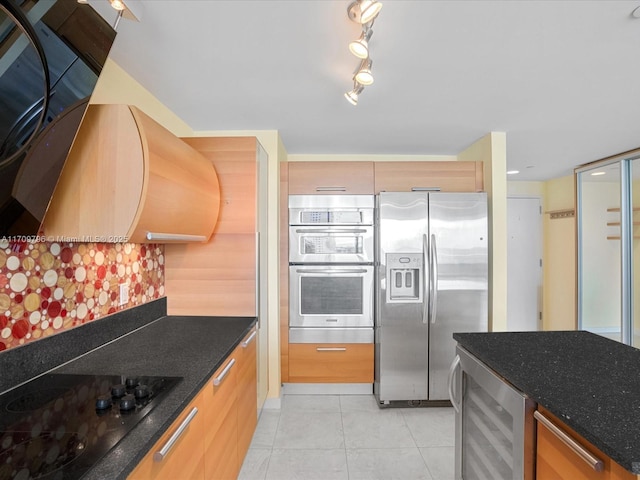 kitchen featuring wine cooler, light tile patterned flooring, dark stone counters, stainless steel appliances, and decorative backsplash