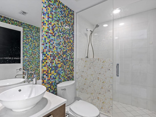 bathroom featuring vanity, tile walls, an enclosed shower, and toilet