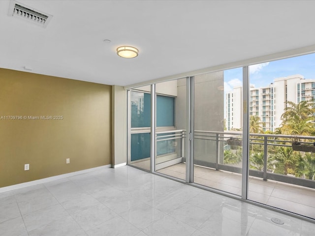 tiled empty room with expansive windows