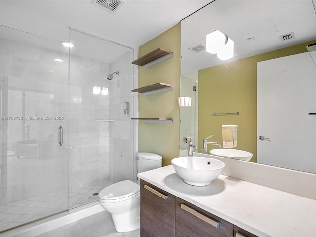 bathroom with vanity, walk in shower, and toilet