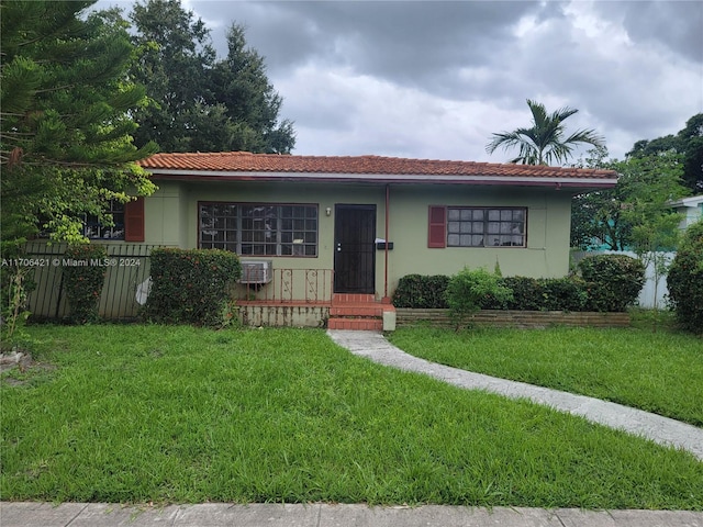 ranch-style house with a front yard