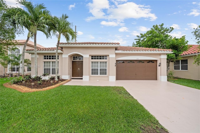 mediterranean / spanish-style house featuring a garage and a front lawn